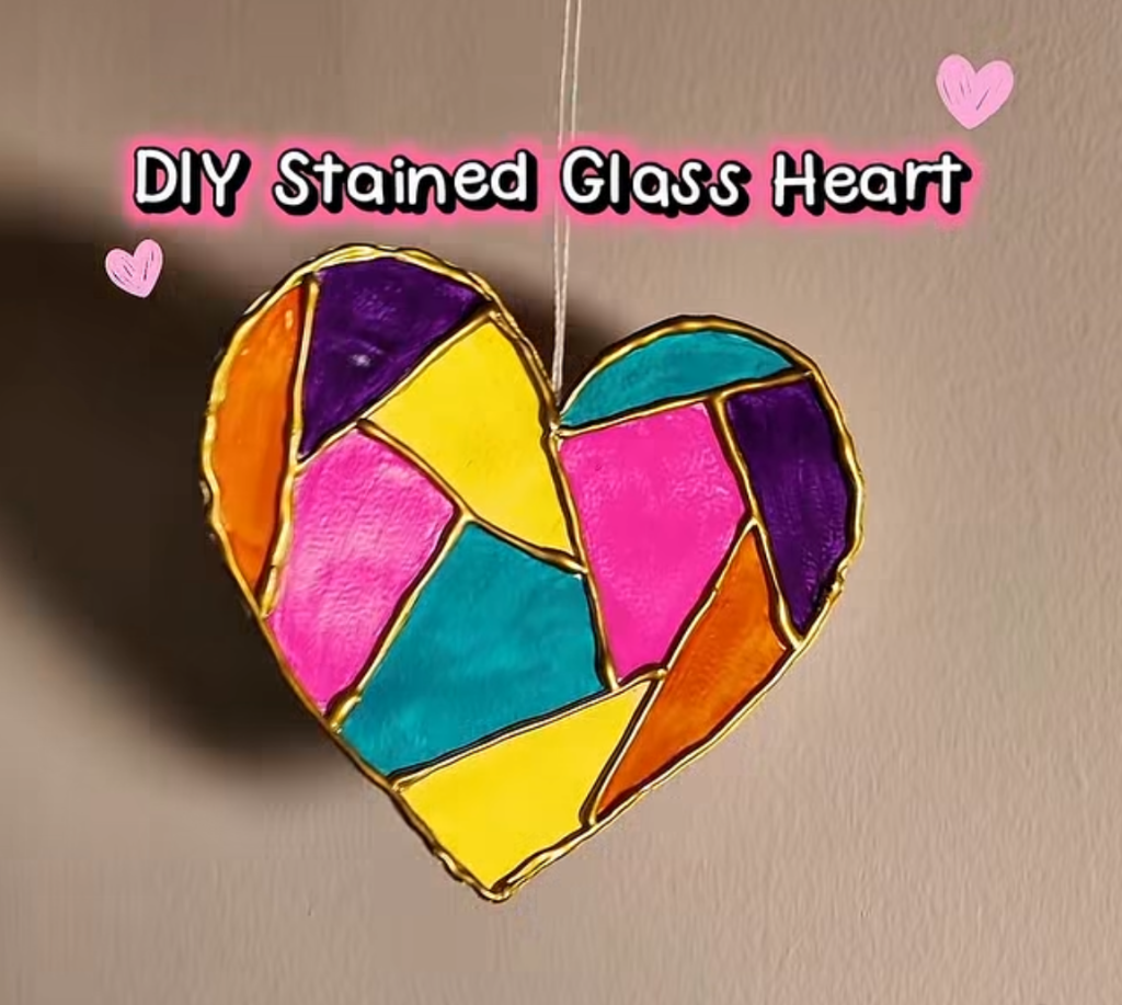 Colorful stained glass heart craft made with bright sections