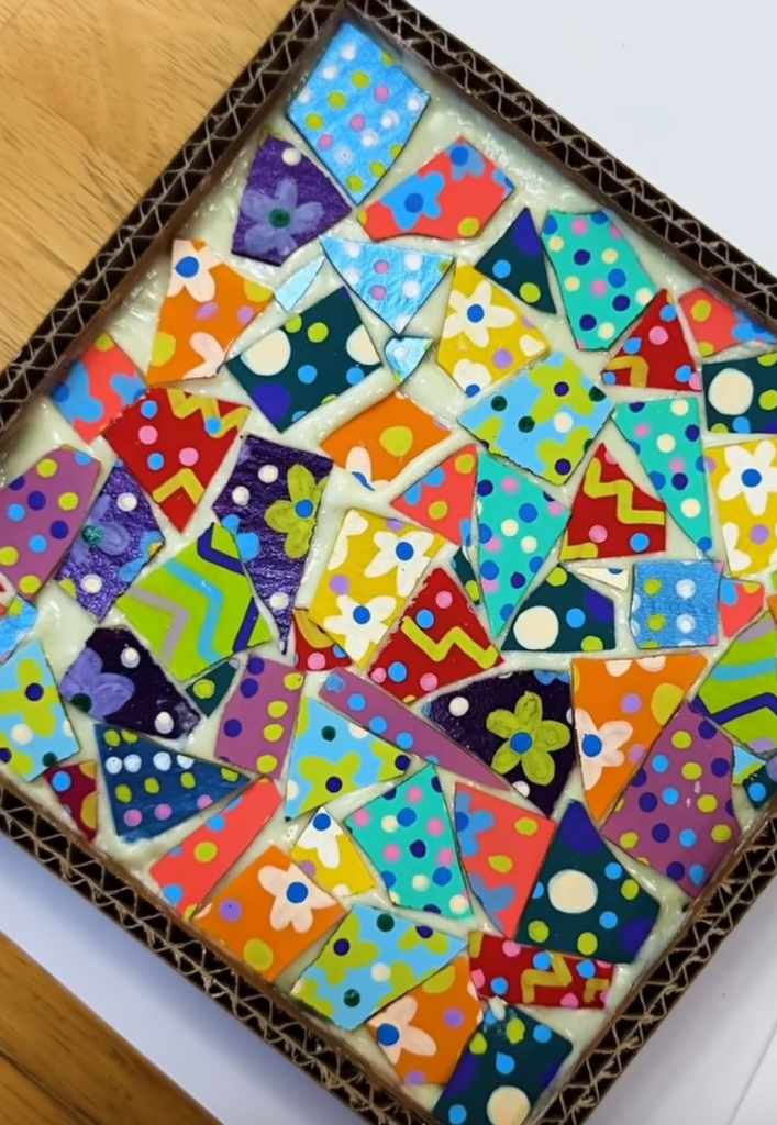 Colorful mosaic craft made with patterned paper pieces