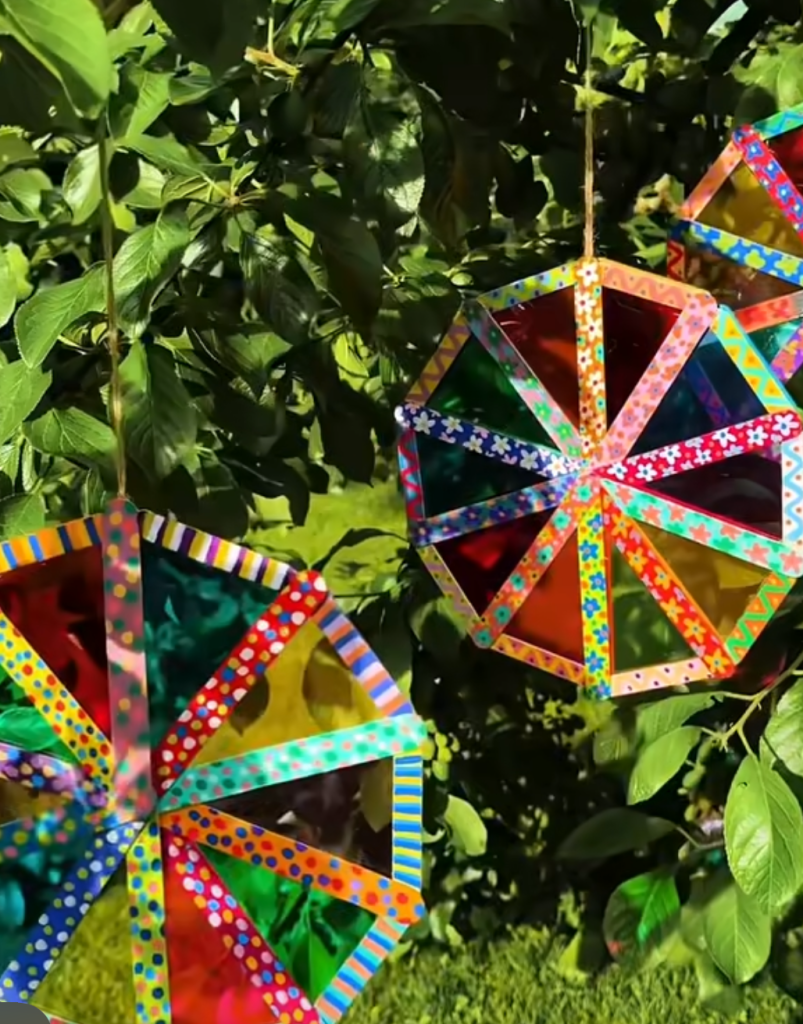 Colorful geometric suncatchers hanging outdoors