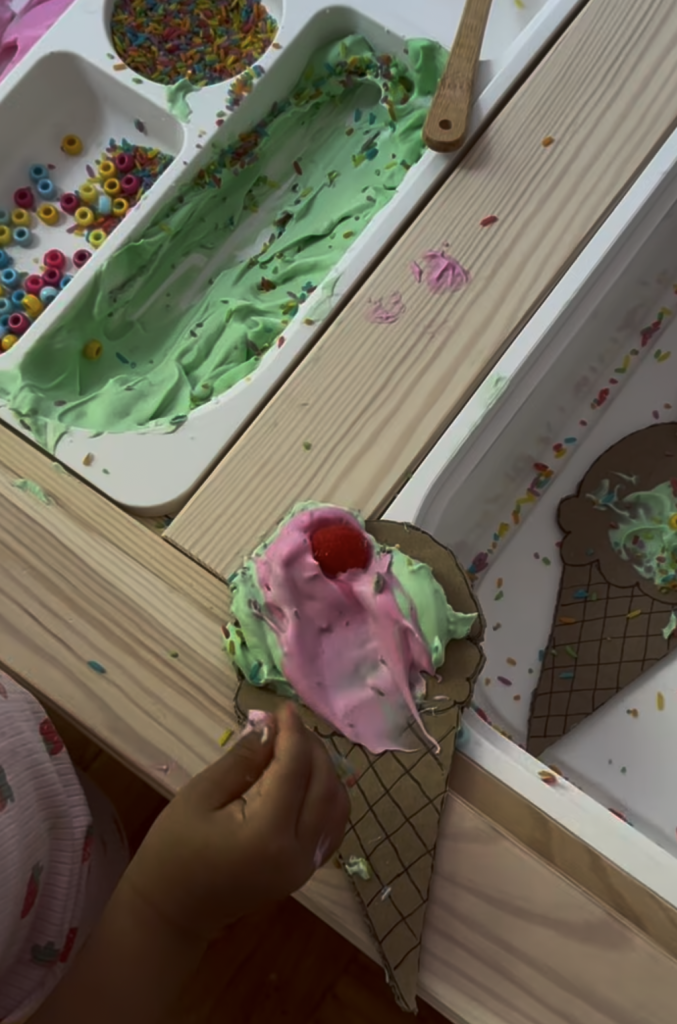 Child creating an ice cream-themed sensory craft