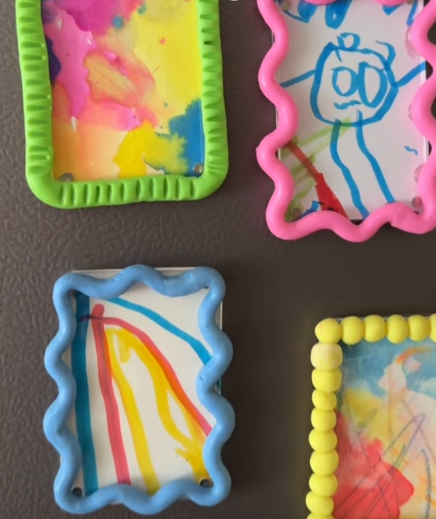 Colorful painted clay frames with children’s drawings